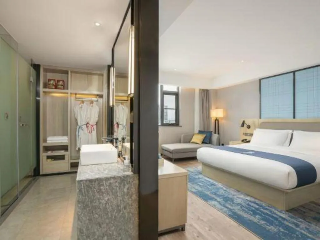 Bed in Echarm Hotel Jianshui Gucheng