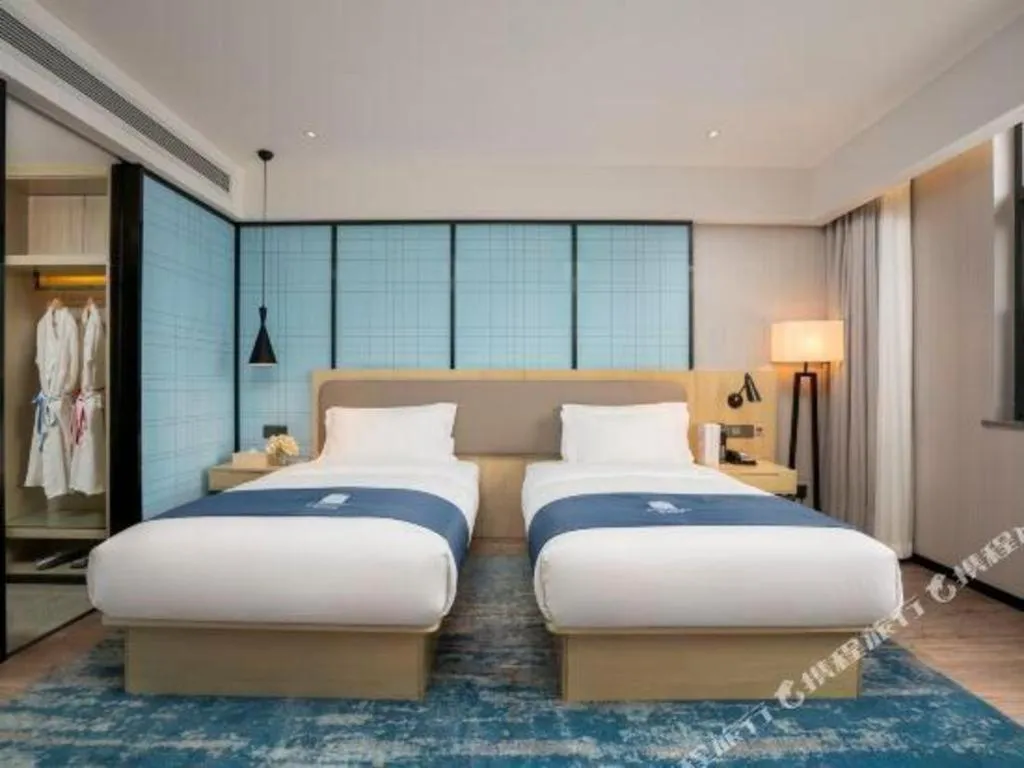Bed in Echarm Hotel Jianshui Gucheng