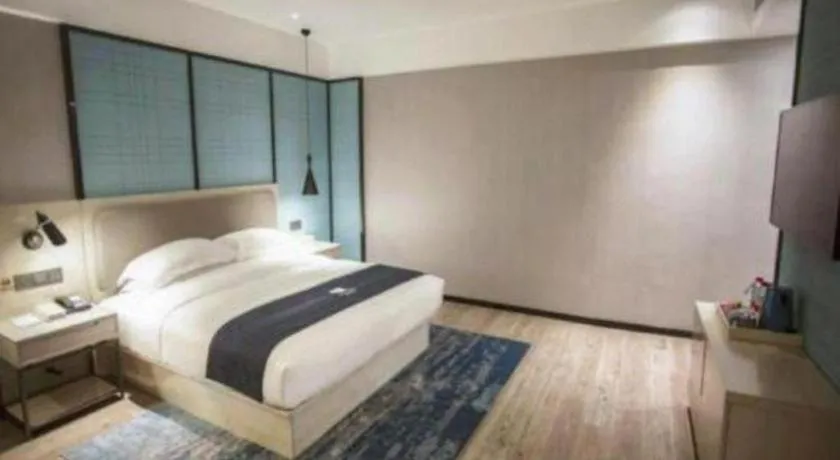 Bed in Echarm Hotel Jianshui Gucheng