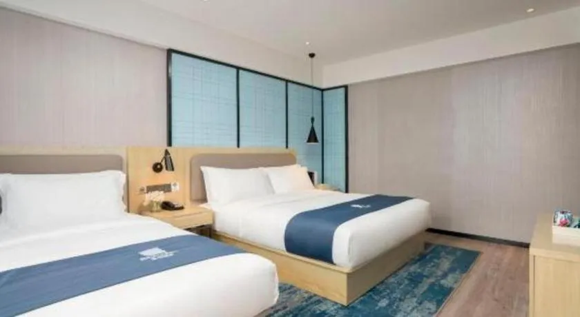 Bed in Echarm Hotel Jianshui Gucheng