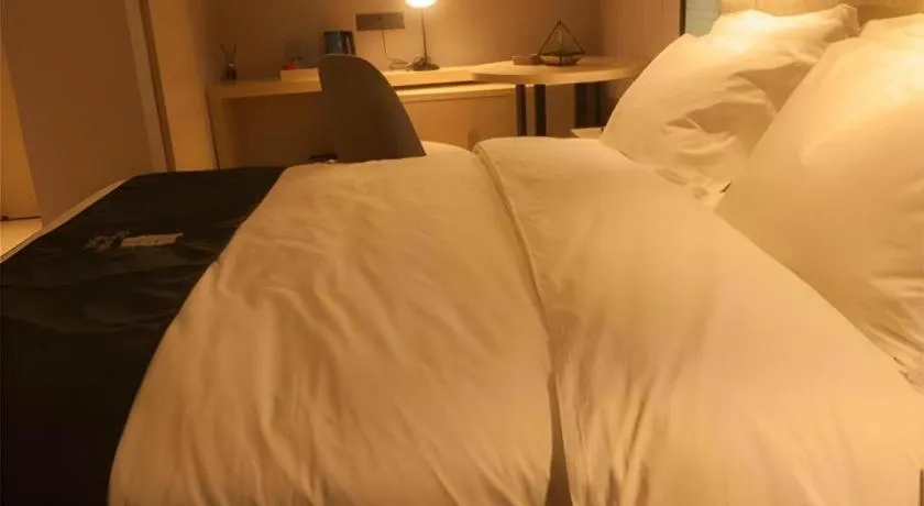 Bed in Echarm Hotel Binzhou Boxing Yinzuo