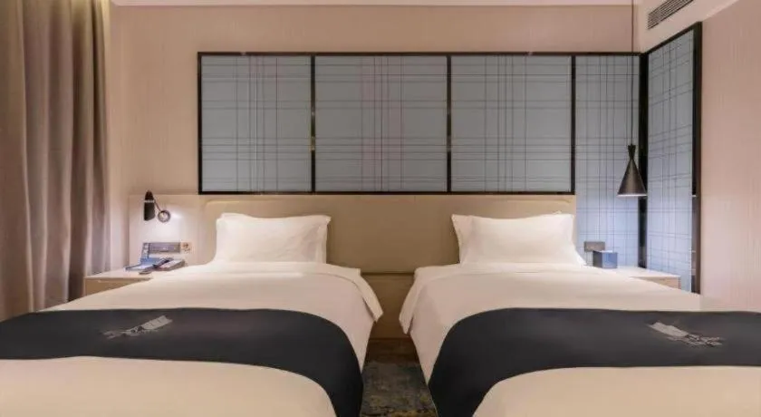 Bed in Echarm Hotel Binzhou Boxing Yinzuo