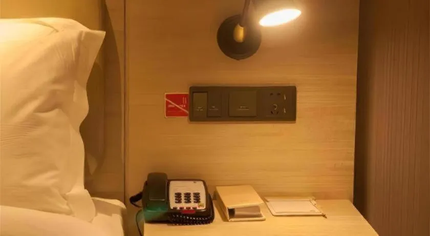 Bed in Echarm Hotel Binzhou Boxing Yinzuo