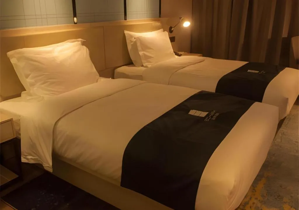 Bed in Echarm Hotel Binzhou Boxing Yinzuo