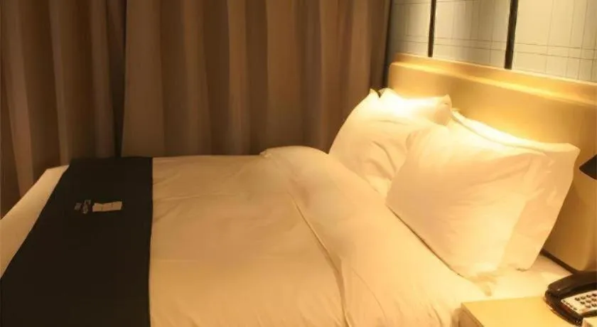 Bed in Echarm Hotel Binzhou Boxing Yinzuo