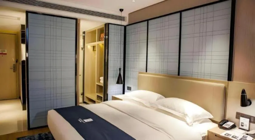 Bed in Echarm Hotel Binzhou Boxing Yinzuo