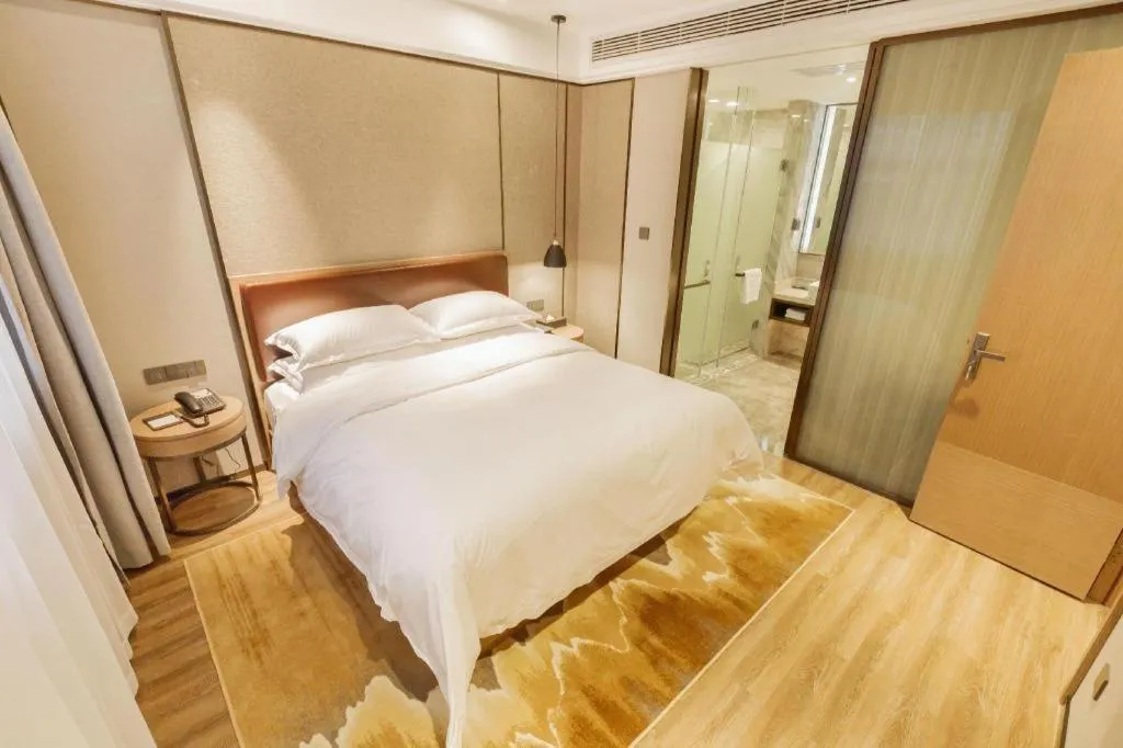 Bed in Borrman Hotel Liuzhou Guizhong Avenue Liugao