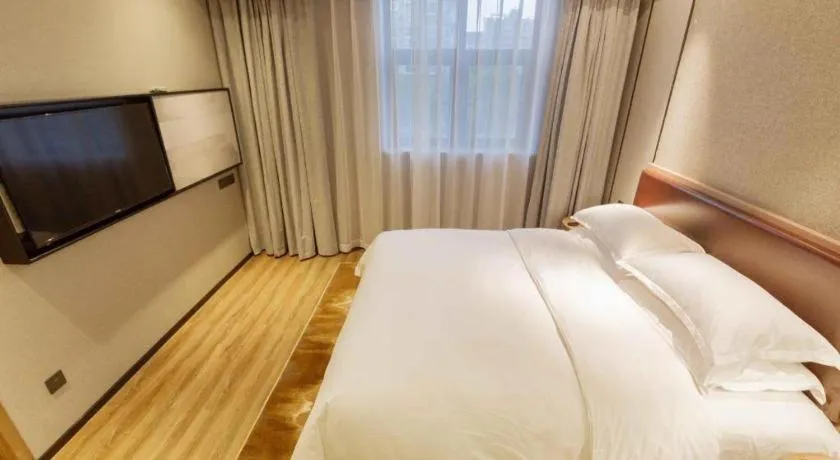 Bed in Borrman Hotel Liuzhou Guizhong Avenue Liugao