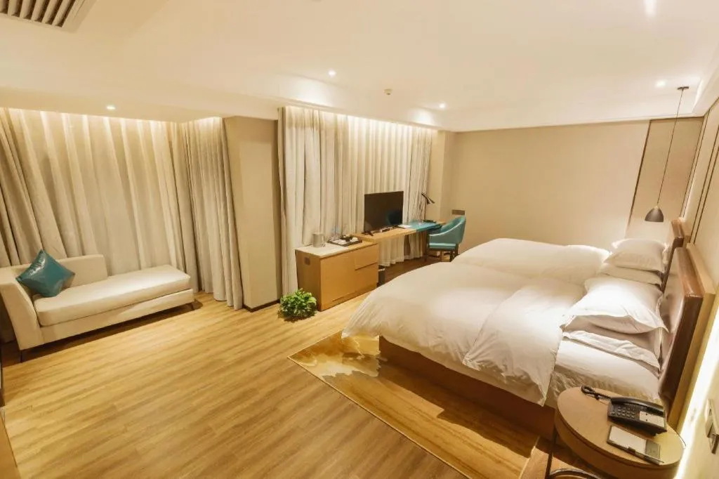 Bed in Borrman Hotel Liuzhou Guizhong Avenue Liugao