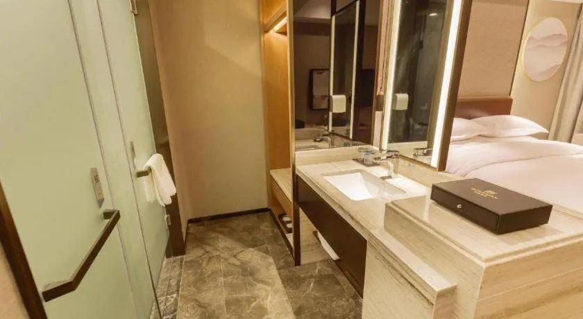 Bed in Borrman Hotel Liuzhou Guizhong Avenue Liugao