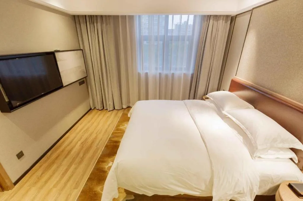 Bed in Borrman Hotel Liuzhou Guizhong Avenue Liugao