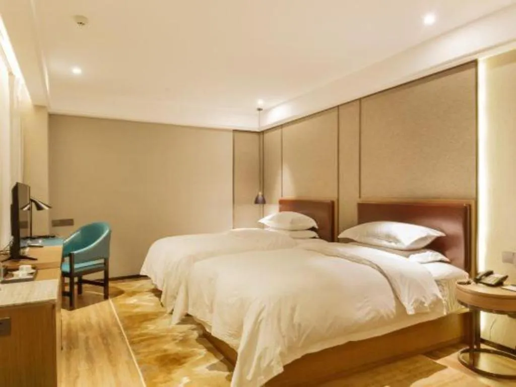Bed in Borrman Hotel Liuzhou Guizhong Avenue Liugao