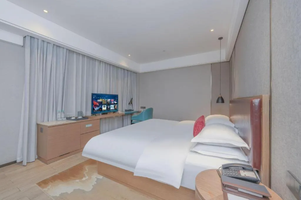 Bed in Borrman Hotel Liuzhou Guizhong Avenue Liugao