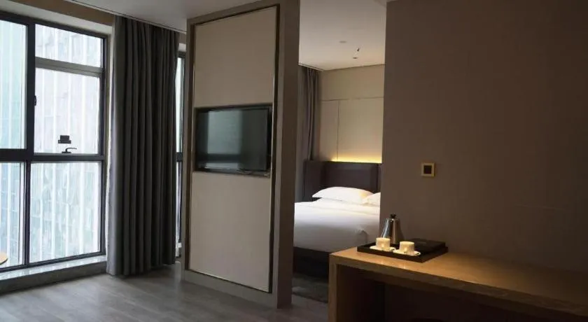 Bed in Echarm Plus Hotel Changsha High-speed Railway South Station Desiqin