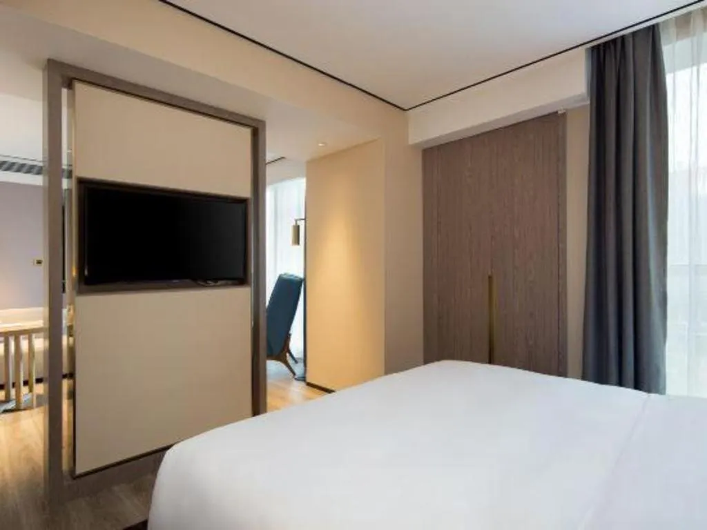 Bed in Echarm Plus Hotel Changsha High-speed Railway South Station Desiqin