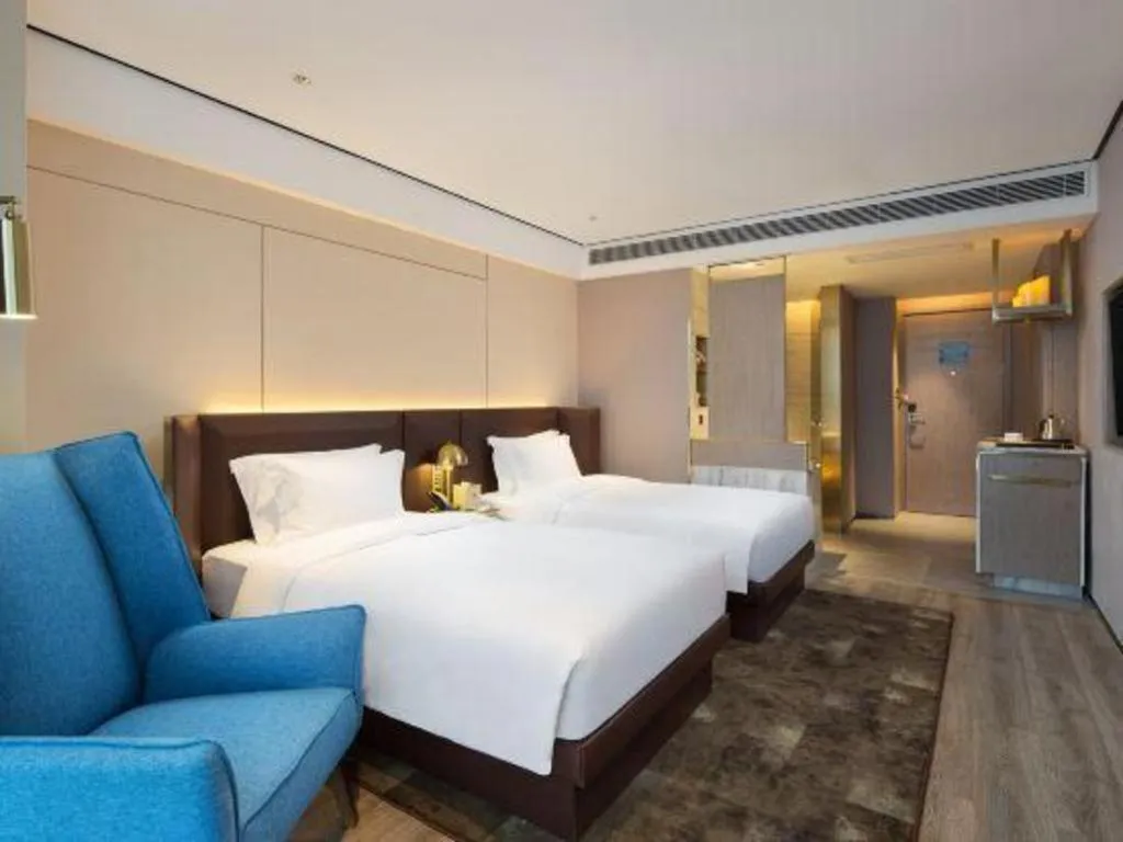 Bed in Echarm Plus Hotel Changsha High-speed Railway South Station Desiqin