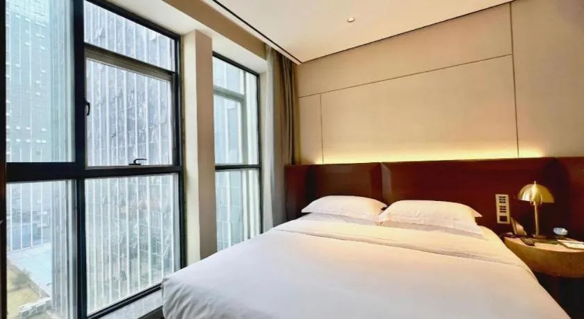 Bed in Echarm Plus Hotel Changsha High-speed Railway South Station Desiqin