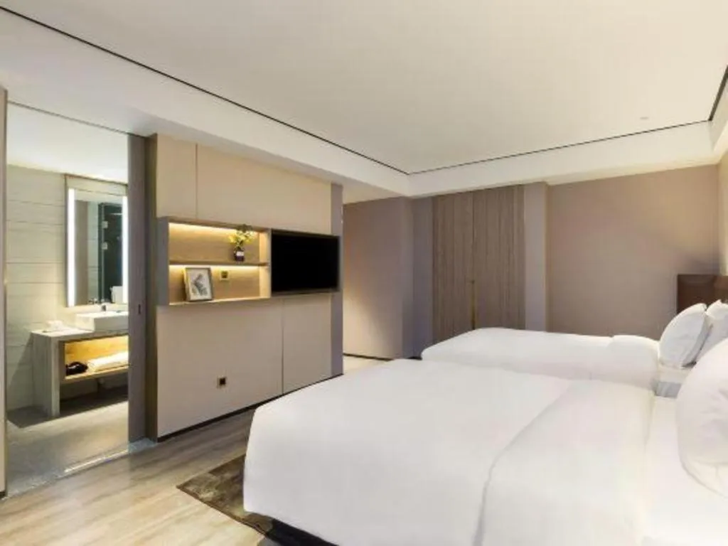 Bed in Echarm Plus Hotel Changsha High-speed Railway South Station Desiqin