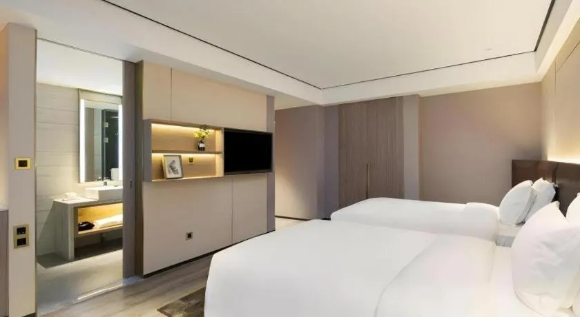 Bed in Echarm Plus Hotel Changsha High-speed Railway South Station Desiqin