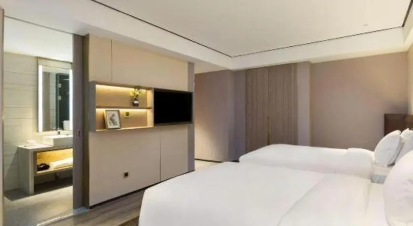 Bed in Echarm Plus Hotel Changsha High-speed Railway South Station Desiqin
