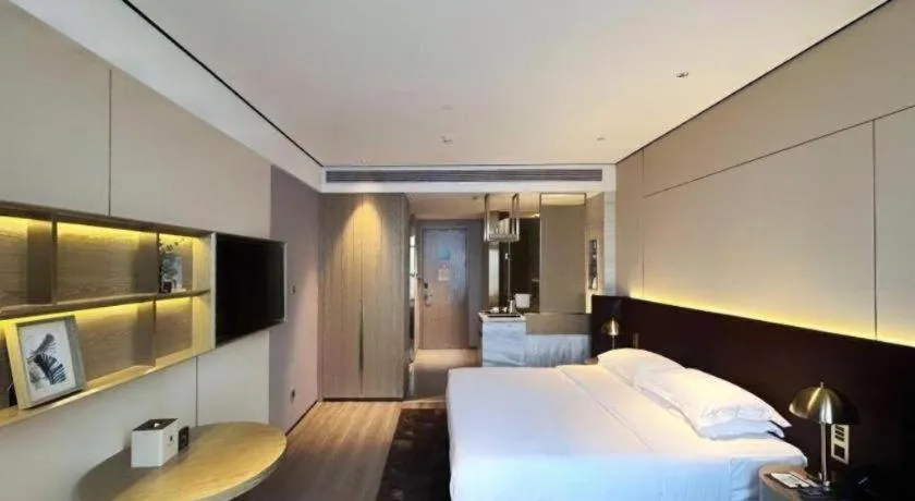 Bed in Echarm Plus Hotel Changsha High-speed Railway South Station Desiqin