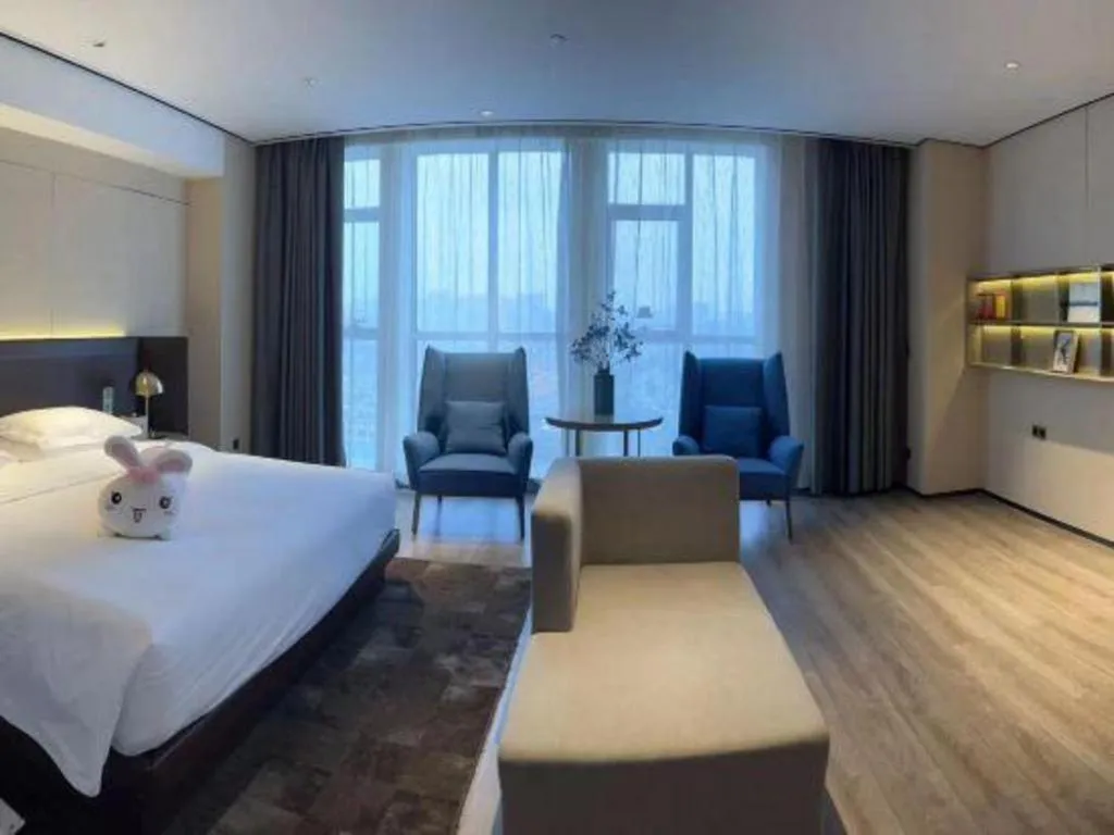 Bed in Echarm Plus Hotel Changsha High-speed Railway South Station Desiqin