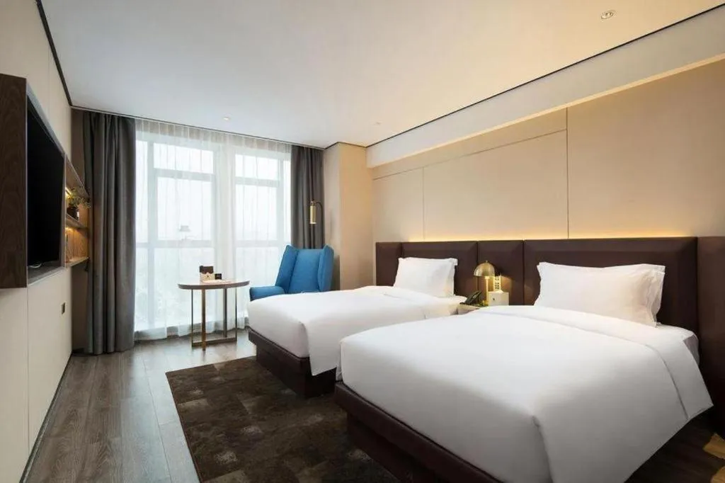 Bed in Echarm Plus Hotel Changsha High-speed Railway South Station Desiqin