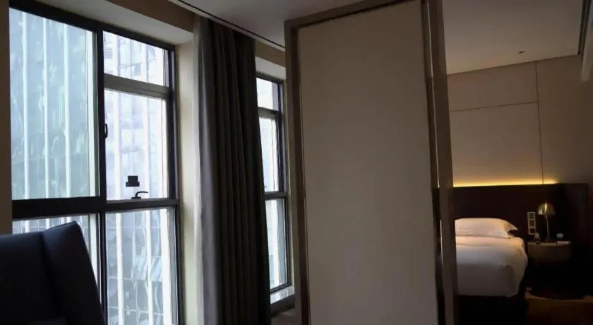 Bed in Echarm Plus Hotel Changsha High-speed Railway South Station Desiqin