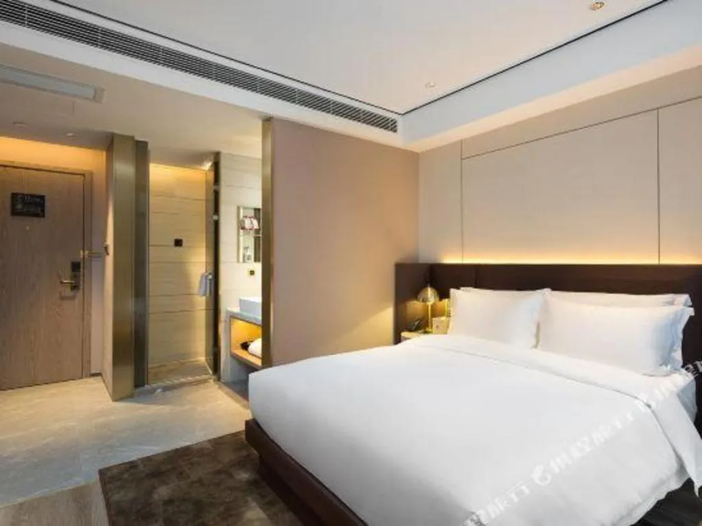 Bed in Echarm Plus Hotel Changsha High-speed Railway South Station Desiqin