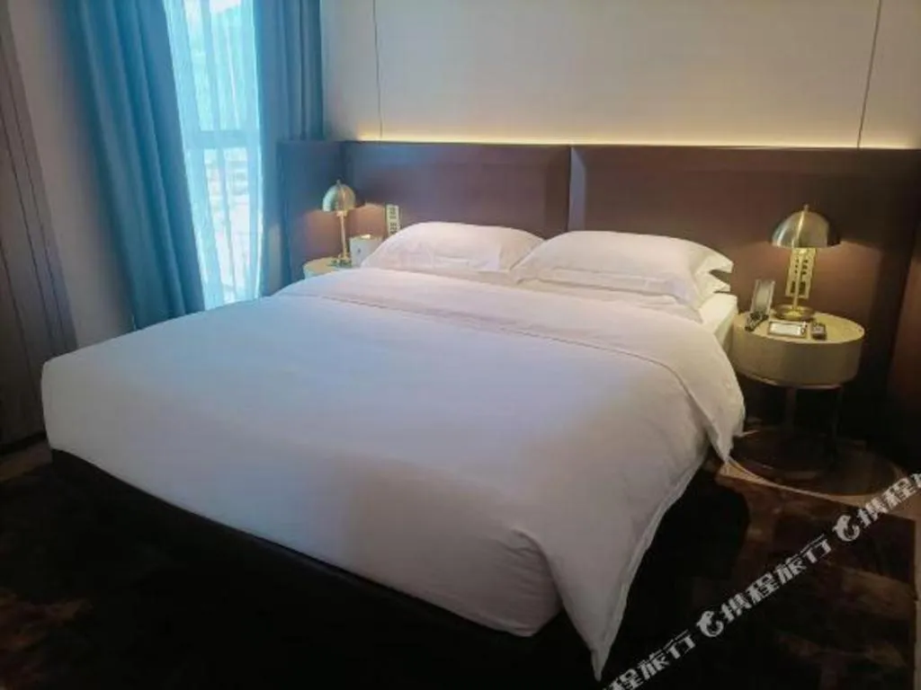 Bed in Echarm Plus Hotel Changsha High-speed Railway South Station Desiqin