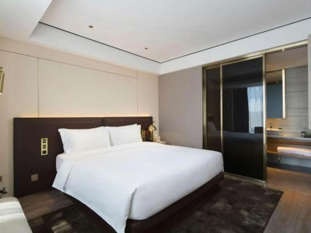Bed in Echarm Plus Hotel Changsha High-speed Railway South Station Desiqin