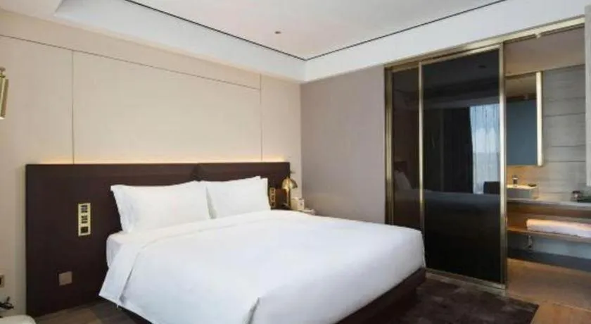 Bed in Echarm Plus Hotel Changsha High-speed Railway South Station Desiqin