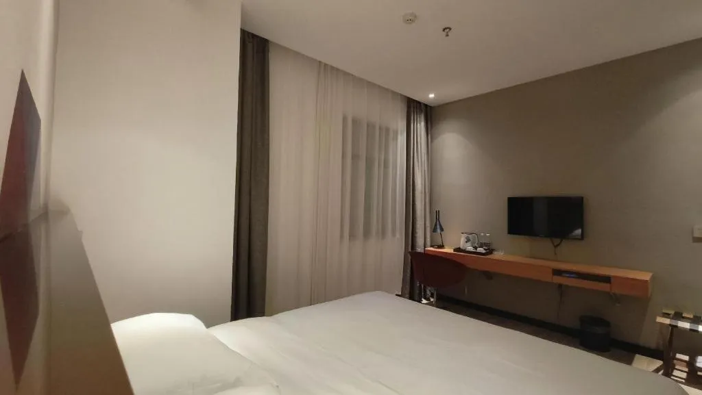 Bed in Borrman Hotel Jingzhou Jiangjin West Road Wanda Plaza Fantawild