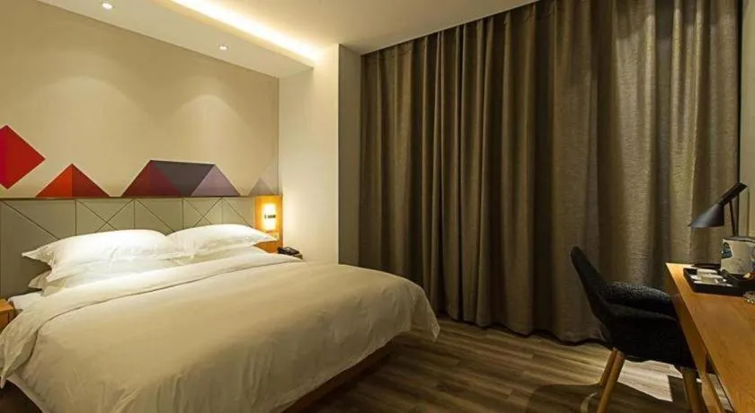 Bed in Borrman Hotel Jingzhou Jiangjin West Road Wanda Plaza Fantawild