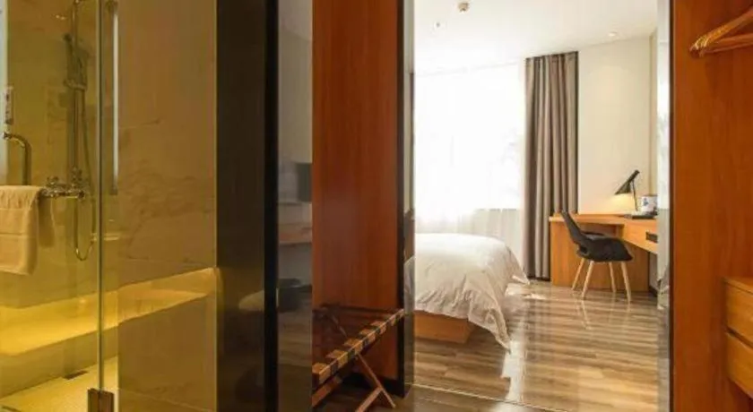 Bed in Borrman Hotel Jingzhou Jiangjin West Road Wanda Plaza Fantawild