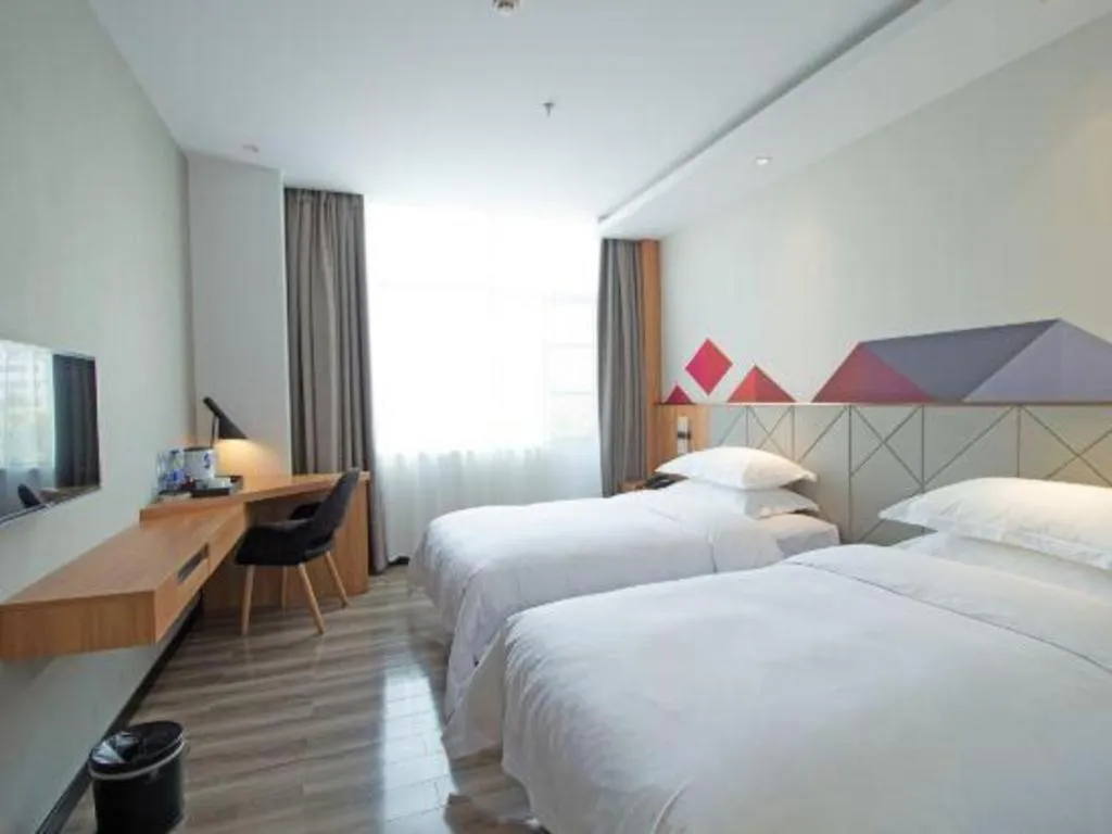 Bed in Borrman Hotel Jingzhou Jiangjin West Road Wanda Plaza Fantawild