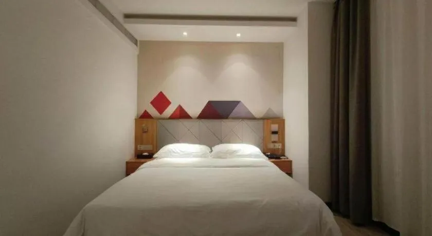Bed in Borrman Hotel Jingzhou Jiangjin West Road Wanda Plaza Fantawild