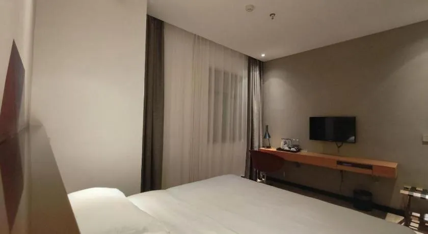 Bed in Borrman Hotel Jingzhou Jiangjin West Road Wanda Plaza Fantawild