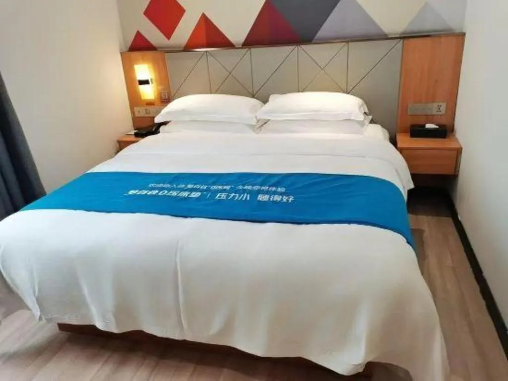 Bed in Borrman Hotel Jingzhou Jiangjin West Road Wanda Plaza Fantawild