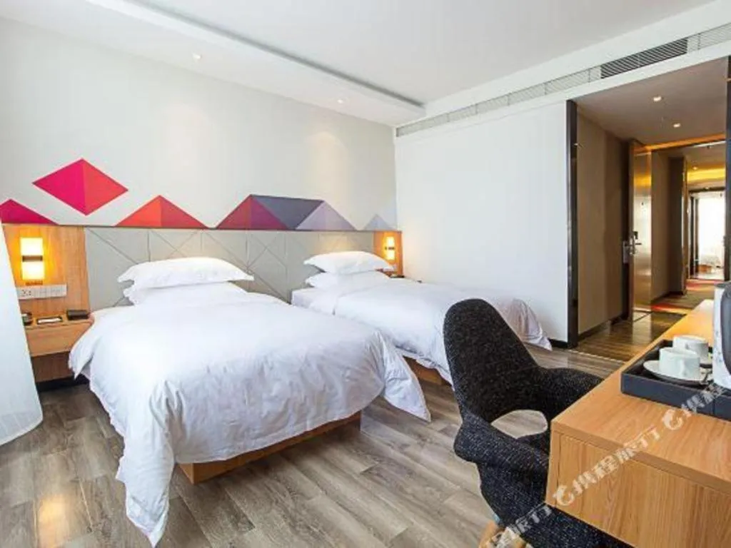 Bed in Borrman Hotel Jingzhou Jiangjin West Road Wanda Plaza Fantawild