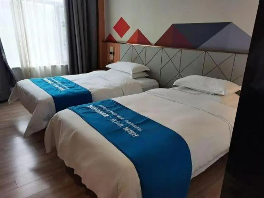 Bed in Borrman Hotel Jingzhou Jiangjin West Road Wanda Plaza Fantawild