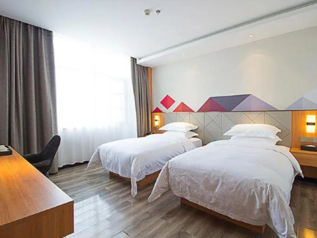 Bed in Borrman Hotel Jingzhou Jiangjin West Road Wanda Plaza Fantawild