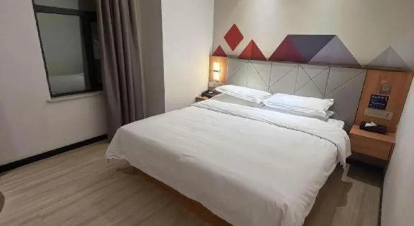 Bed in Borrman Hotel Jingzhou Jiangjin West Road Wanda Plaza Fantawild