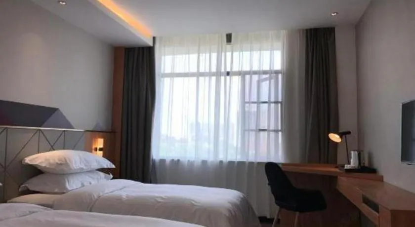 Bed in Borrman Hotel Jingzhou Jiangjin West Road Wanda Plaza Fantawild