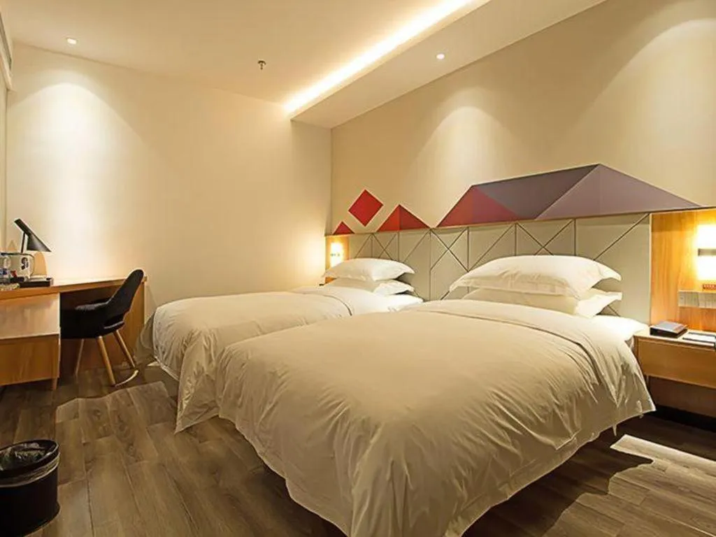 Bed in Borrman Hotel Jingzhou Jiangjin West Road Wanda Plaza Fantawild