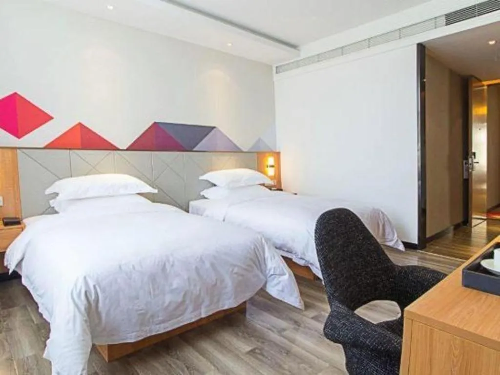 Bed in Borrman Hotel Jingzhou Jiangjin West Road Wanda Plaza Fantawild