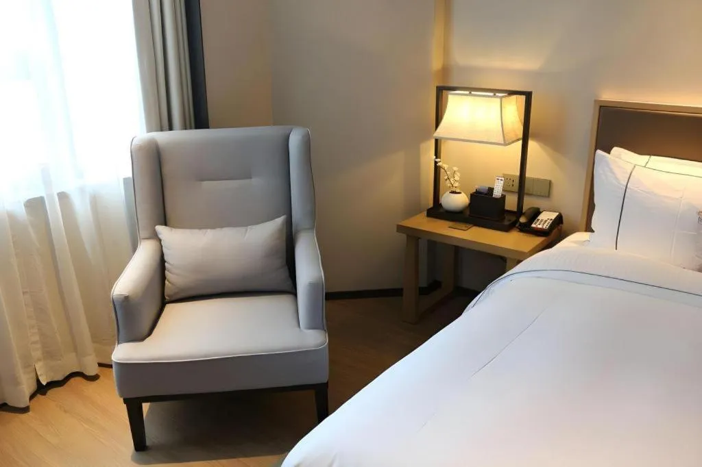 Bed in Echeng Hotel Changsha Evening News