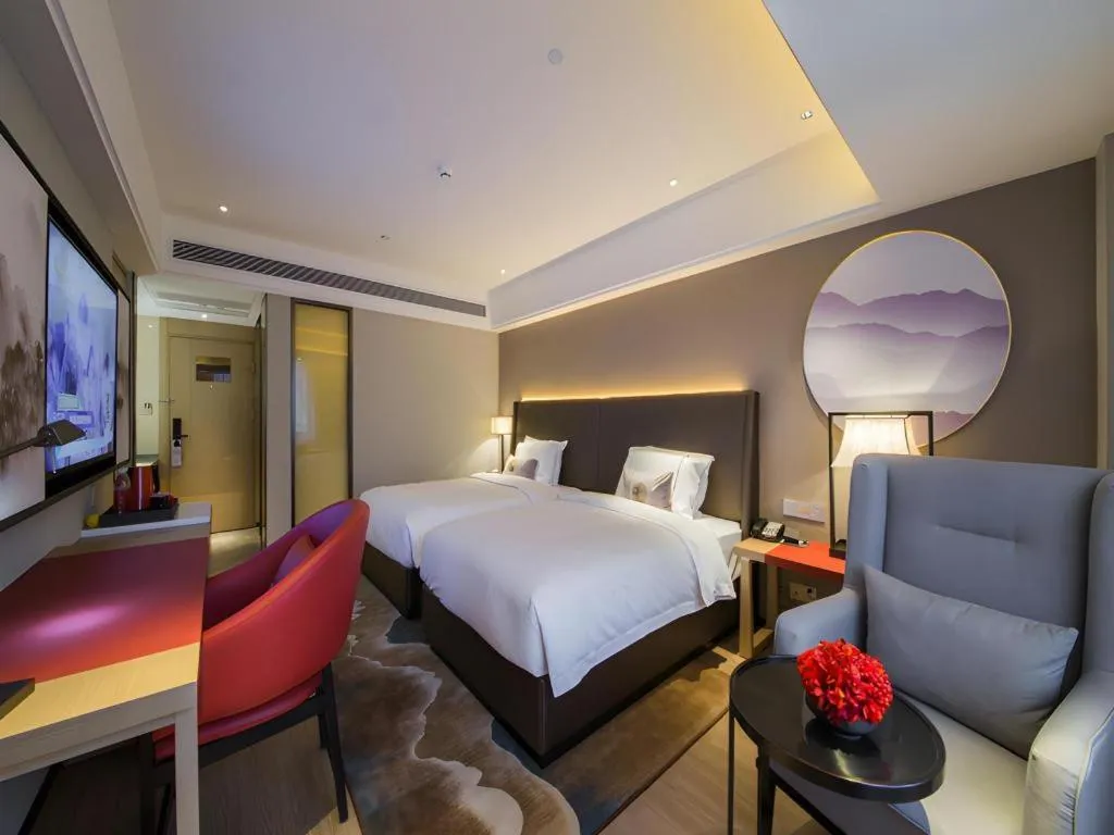 Bed in Echeng Hotel Changsha Evening News