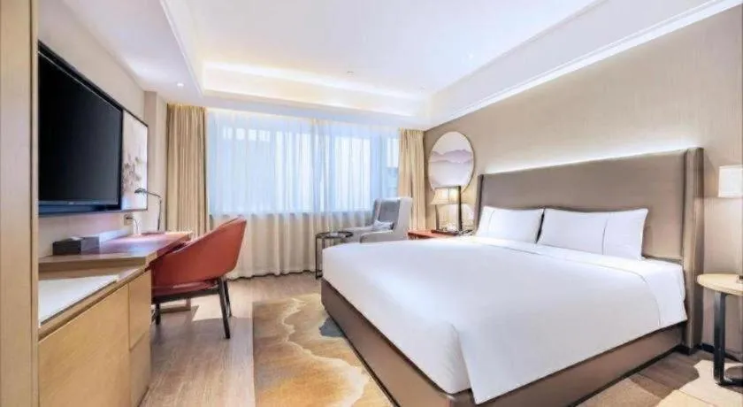 Bed in Echeng Hotel Changsha Evening News