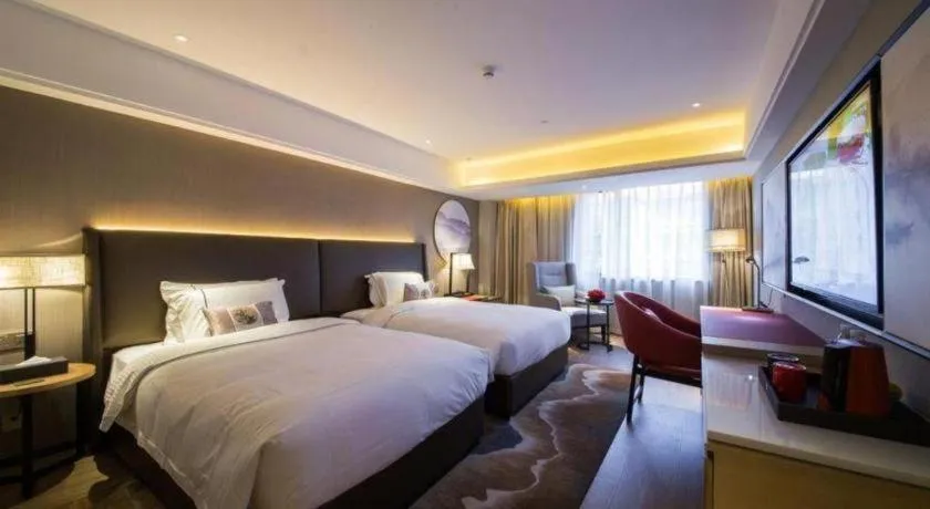 Bed in Echeng Hotel Changsha Evening News